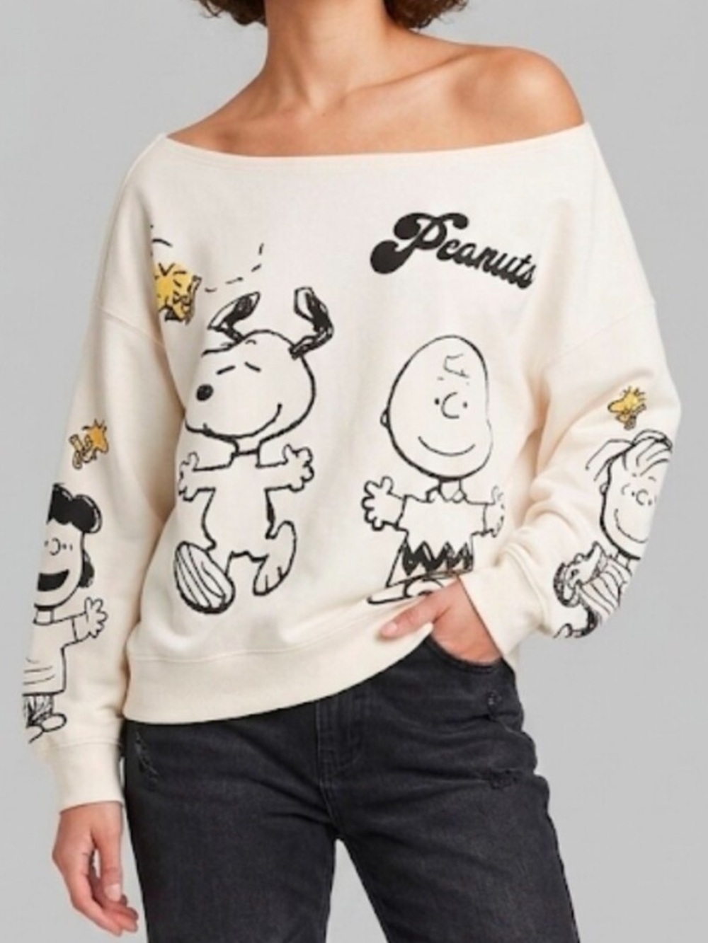 Peanuts Cream Off-Shoulder Snoopy & Friends Graphic Sweater